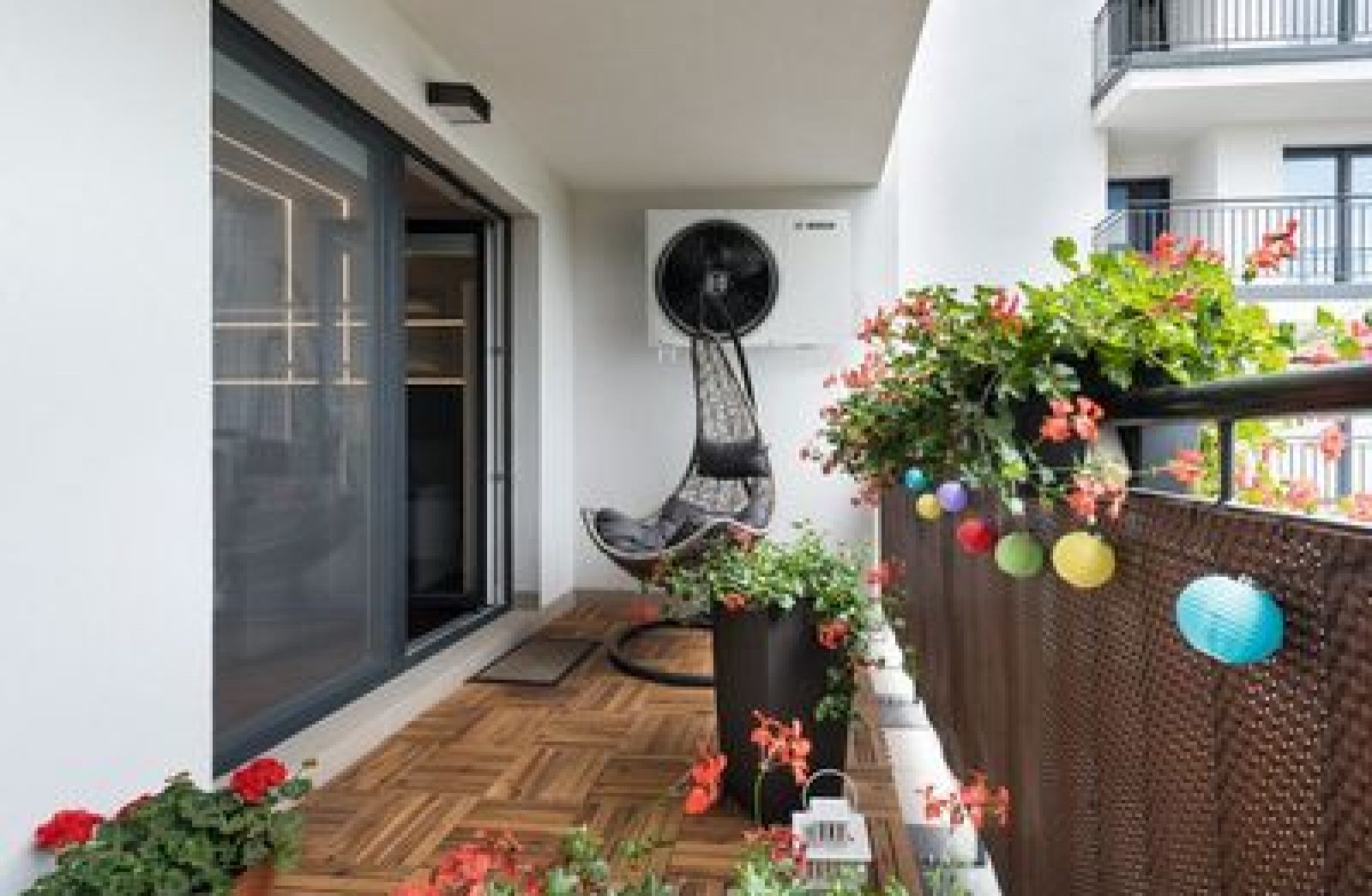 Home terrace with wooden floor and chair; Shutterstock ID 675585040